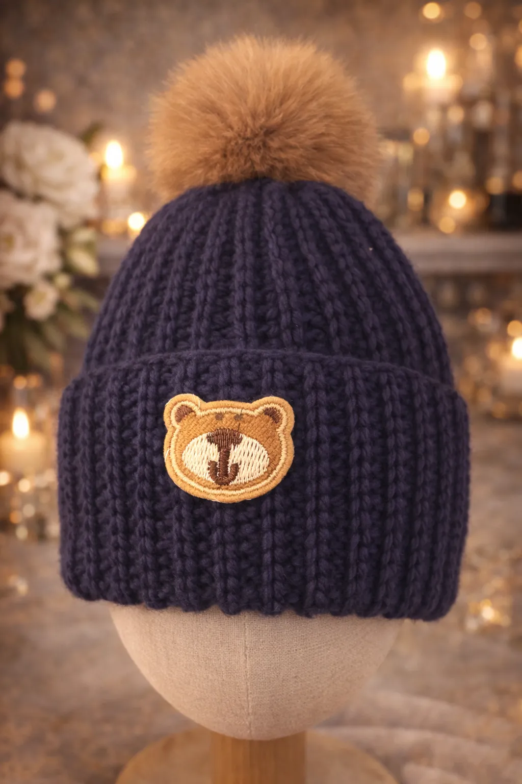 Violet baby beanie with a bear patch.